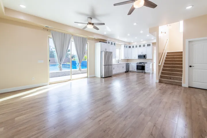 Unfurnished living room featuring ceiling fan, recessed lighting, and light wood-type flooring