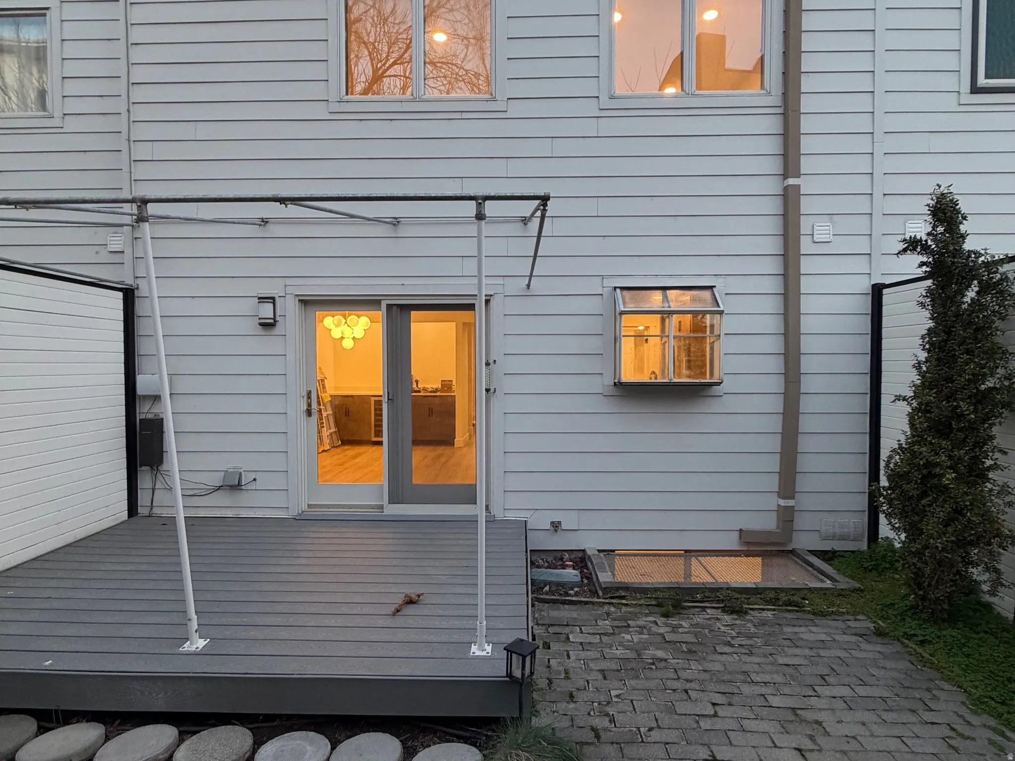 Back of house with a patio and a deck