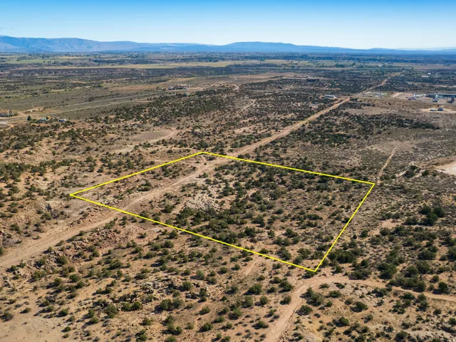 View of rural area with a mountain backdrop and property parcel outlined
