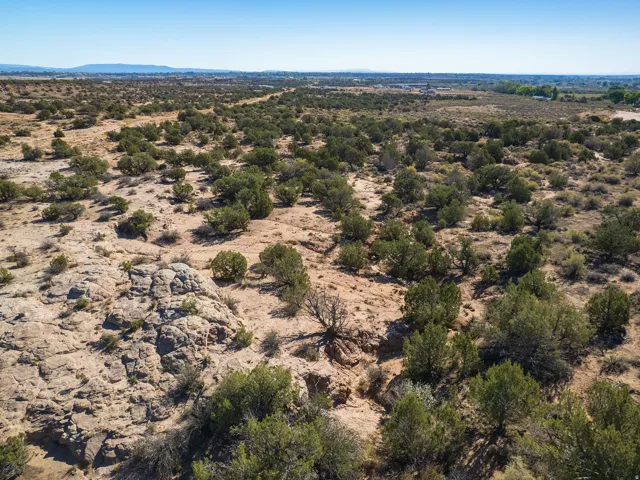 Overview of rural landscape with a desert landscape and a mountainous background