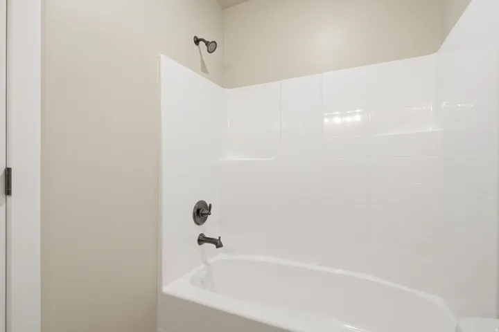 Bathroom featuring bathing tub / shower combination