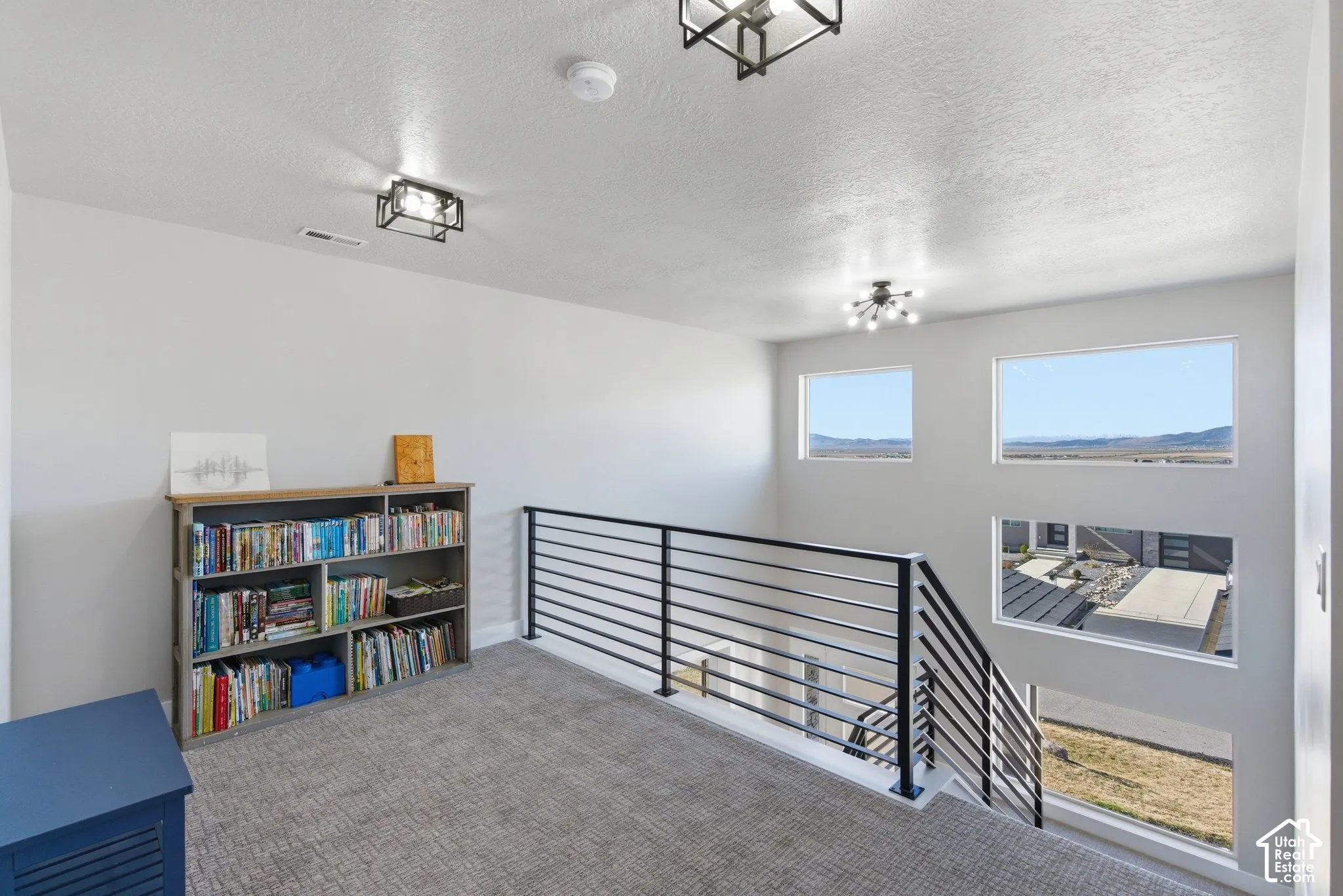 Large Loft area on Level 2 could be used as an entertaining/gaming space, piano area, or reading nook; amazing mountain views!