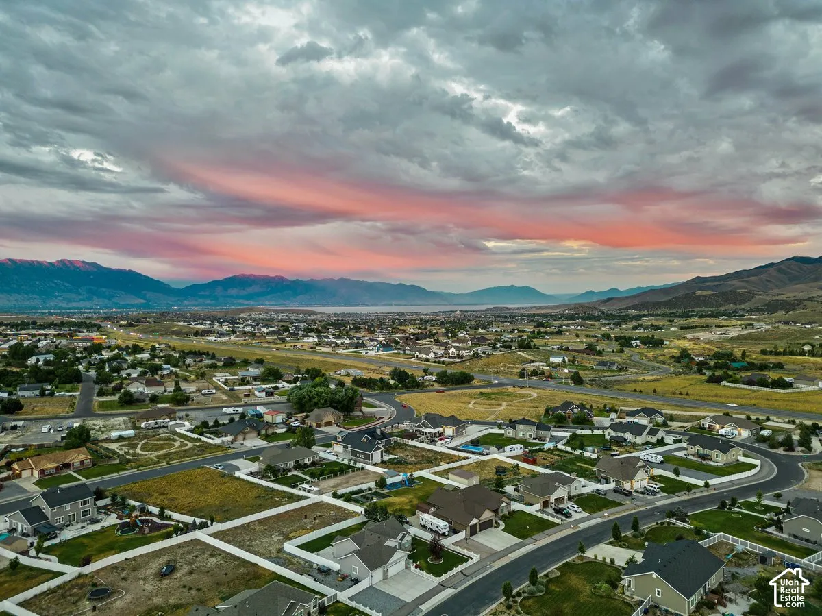 Expansive residential development featuring paved roads and mountain backdrop