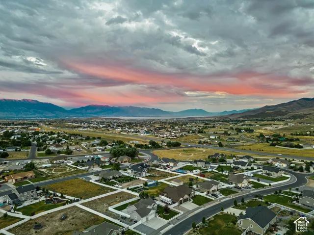 Expansive residential development featuring paved roads and mountain backdrop