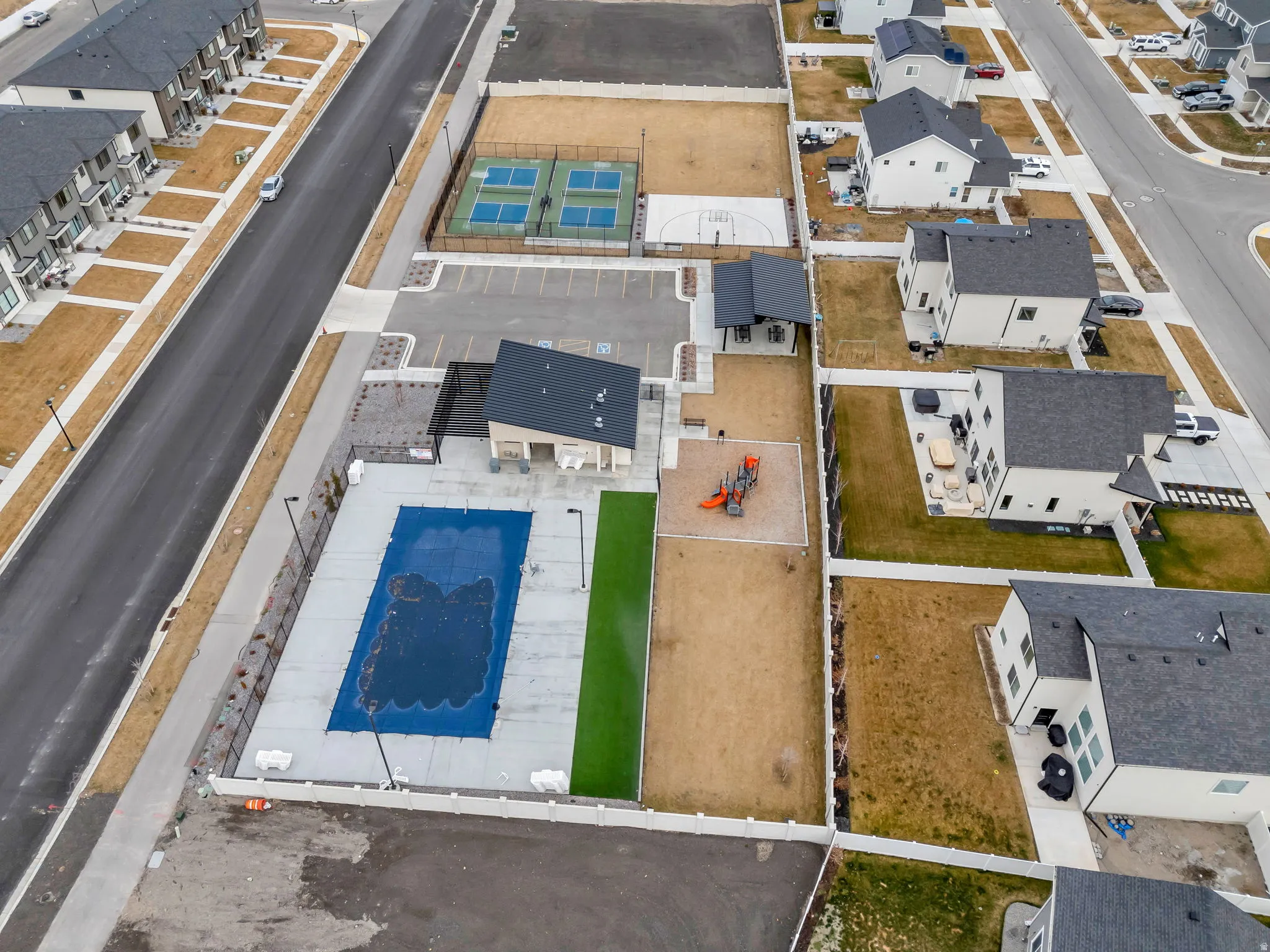 Aerial perspective of suburban area with a pool area