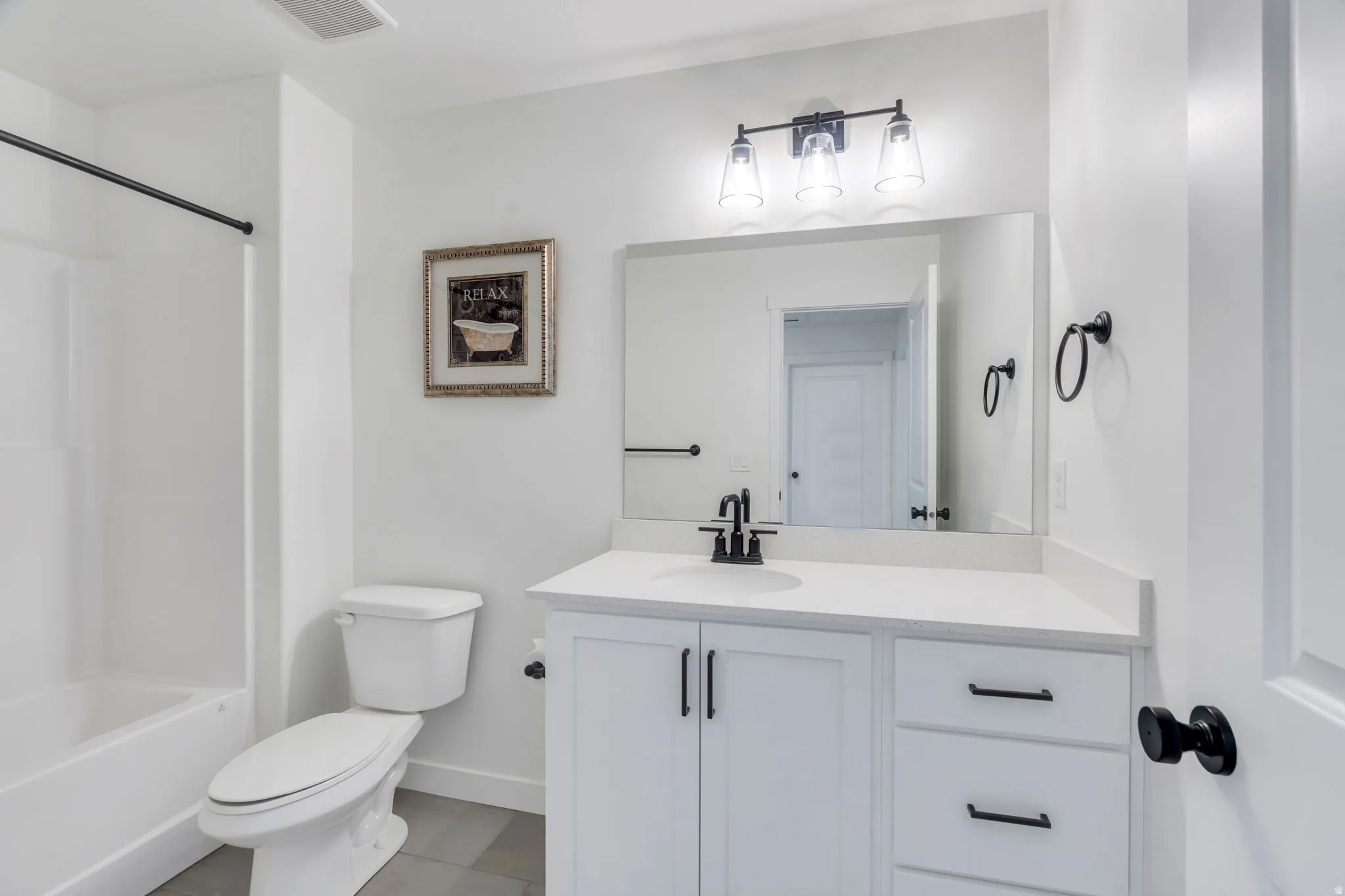 Bathroom with vanity and  shower combination