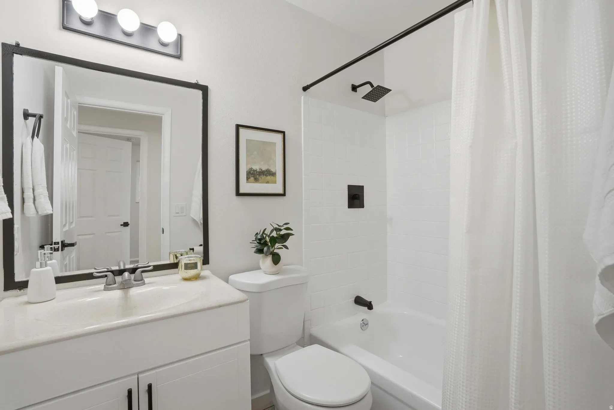 Full bathroom with vanity and shower / bath combo with shower curtain