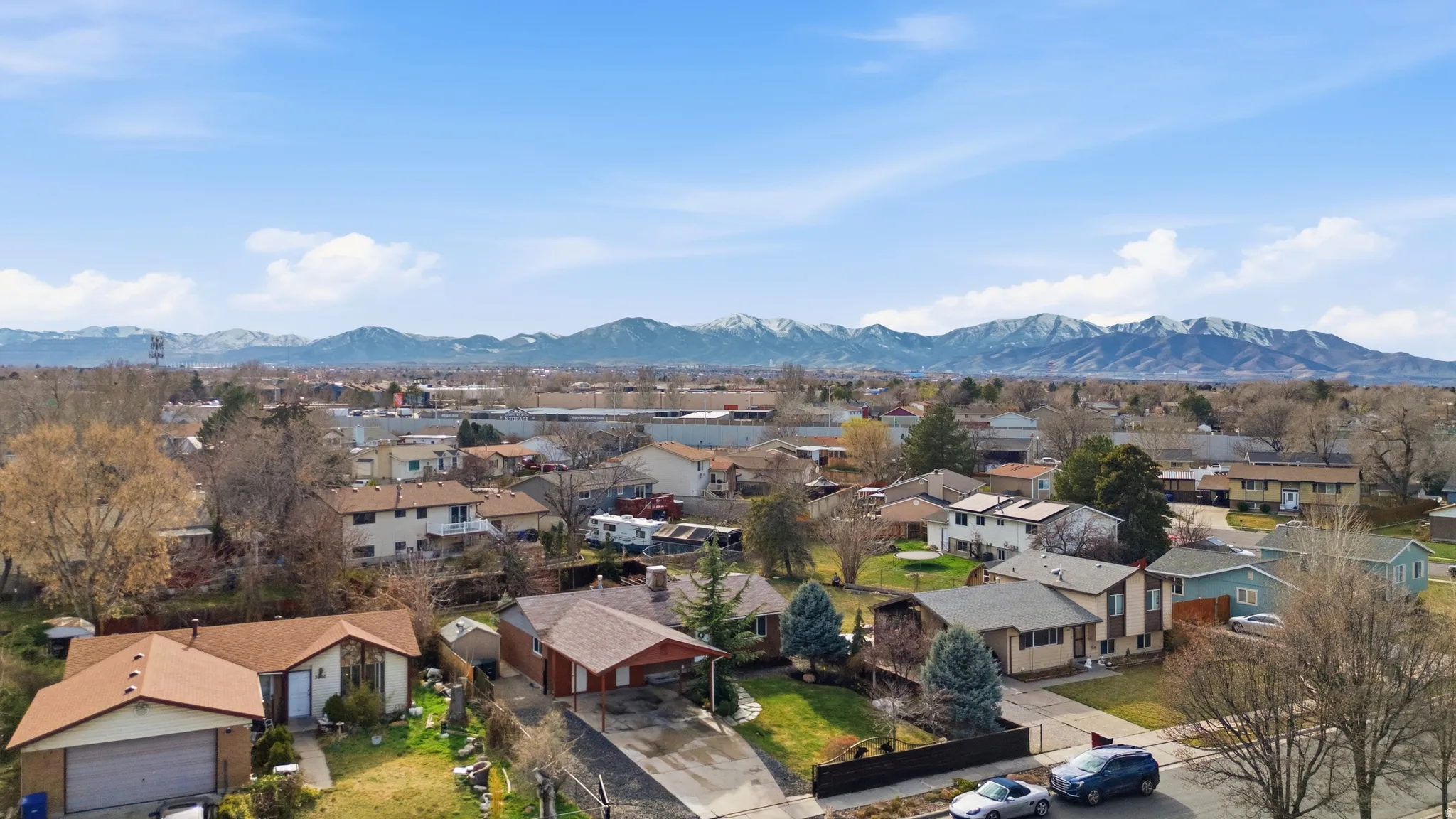 Aerial perspective of suburban area with mountains
