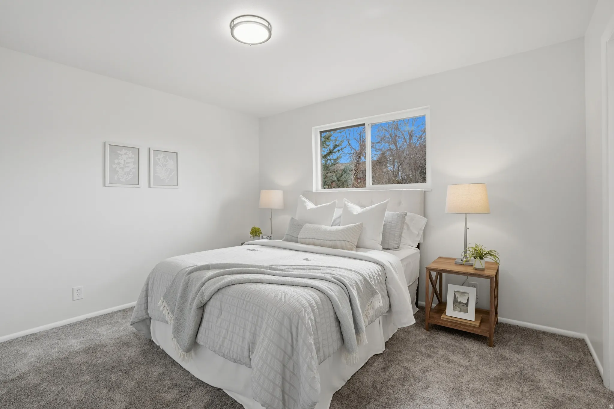 Carpeted bedroom featuring baseboards