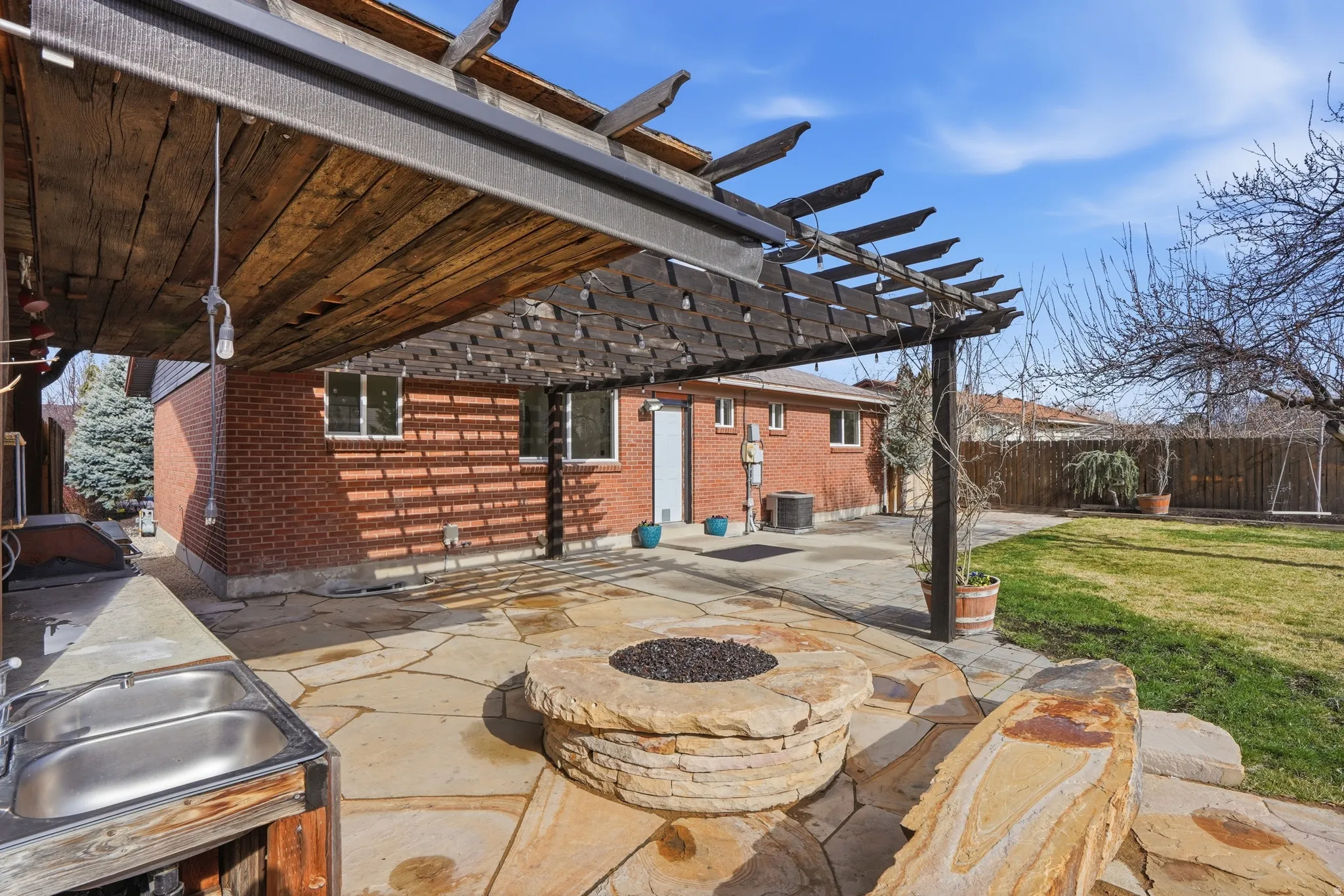 View of patio featuring an outdoor fire pit and a pergola