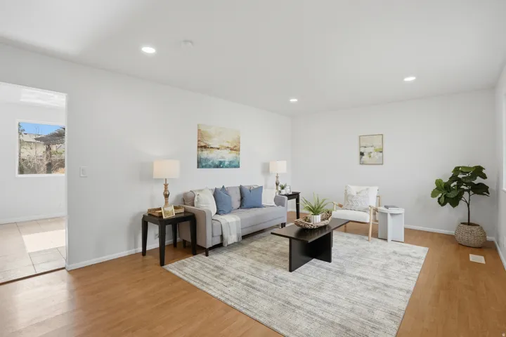 Living room featuring light wood-style floors and recessed lighting