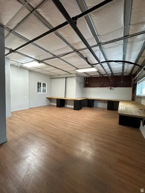 Misc room with light wood-style flooring and baseboards