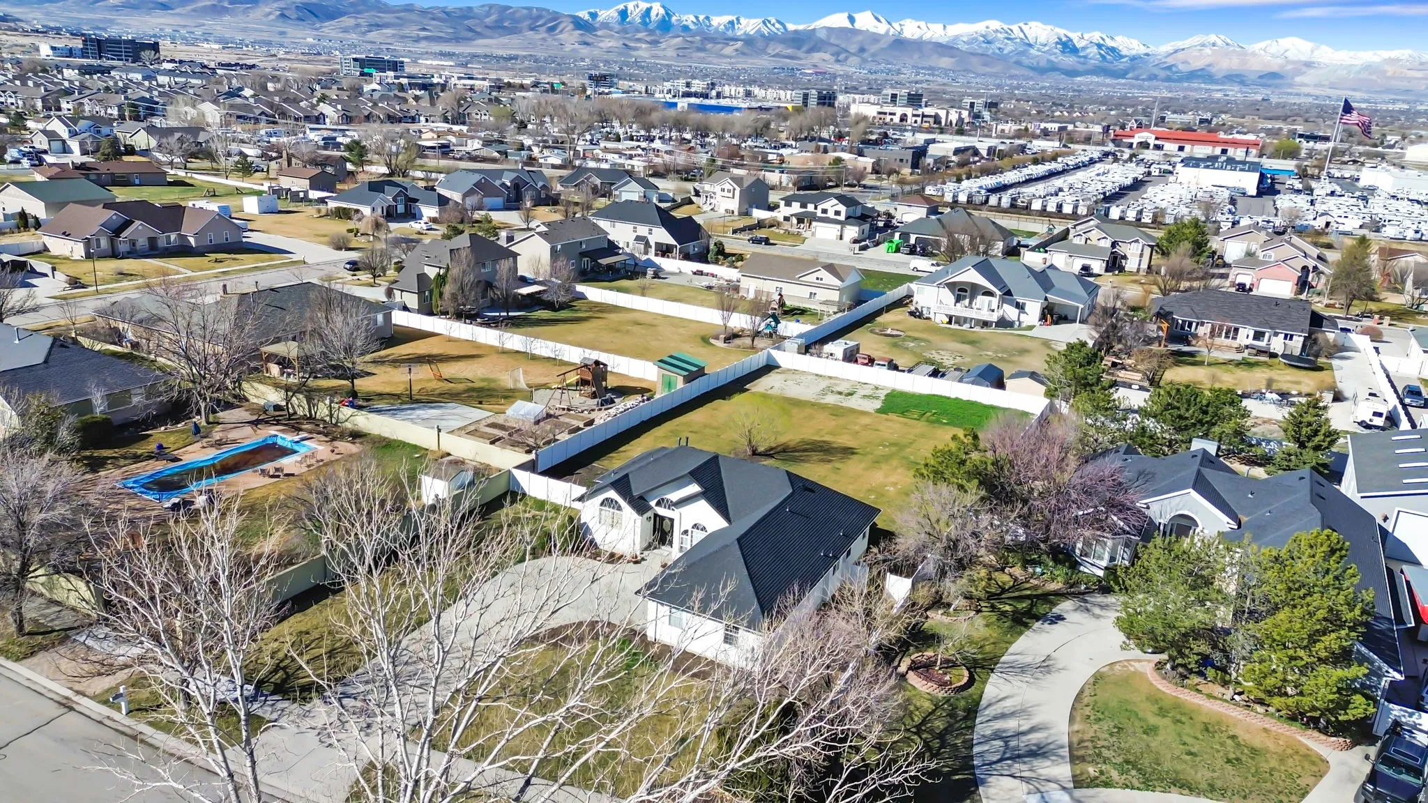 Aerial perspective of suburban area with a mountainous background