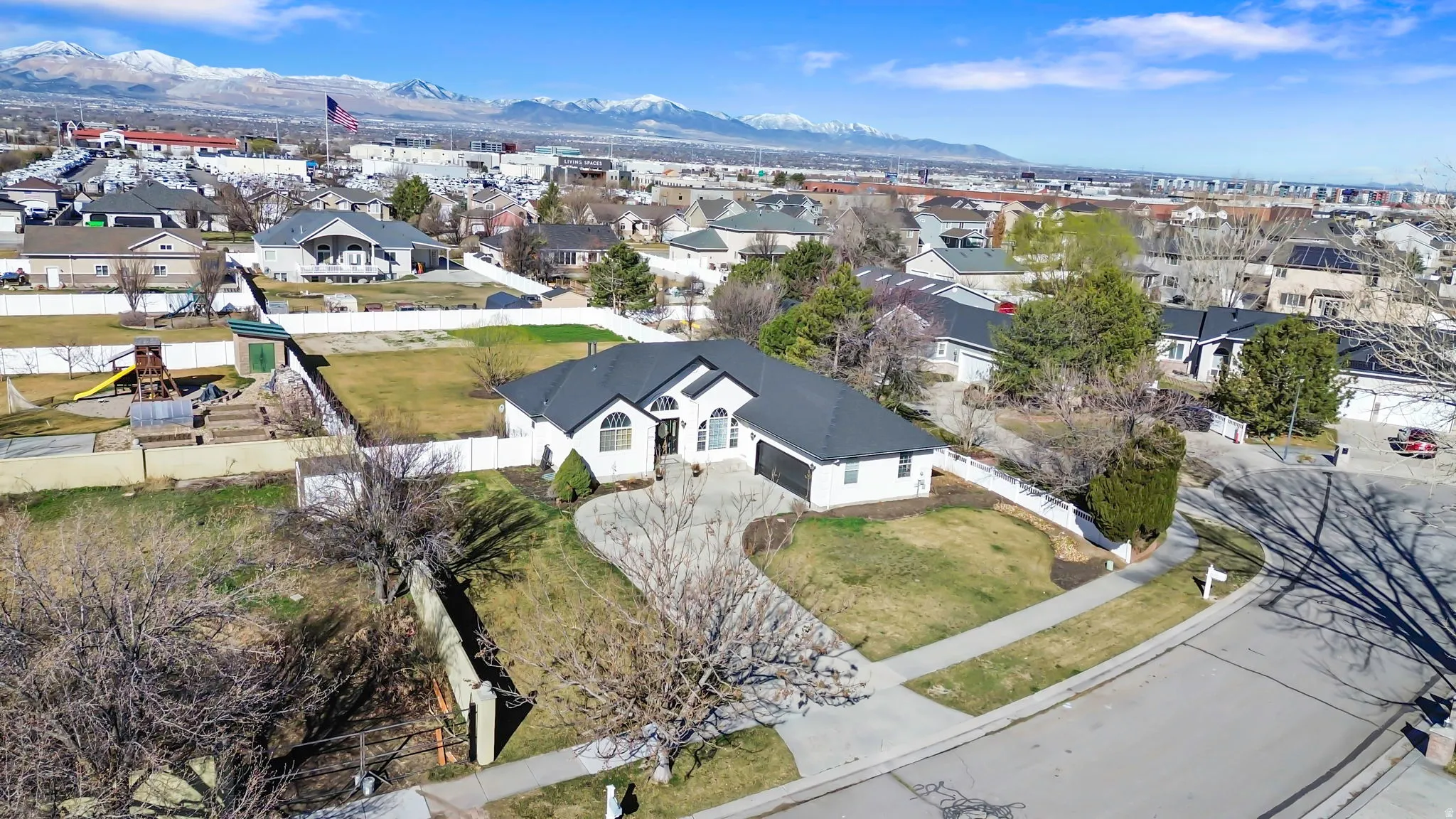 Aerial perspective of suburban area with a mountain backdrop