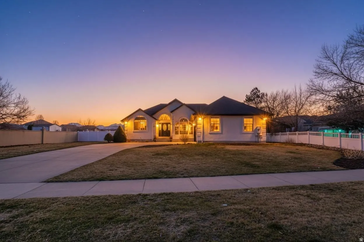 View of front of house featuring concrete driveway
