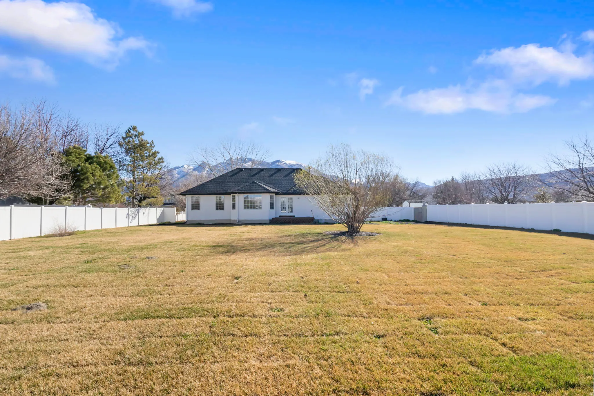 Rear view of property featuring a mountain view