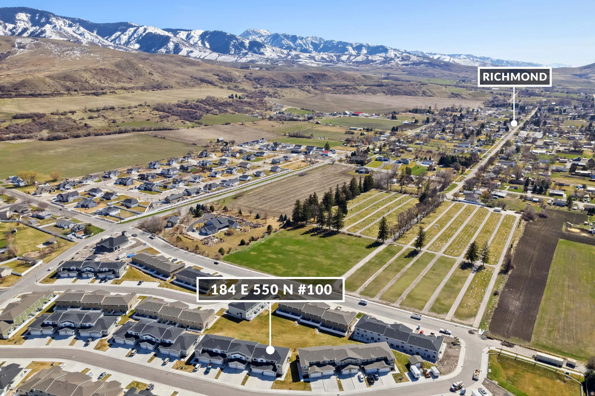 View of property location featuring a mountainous background and nearby suburban area