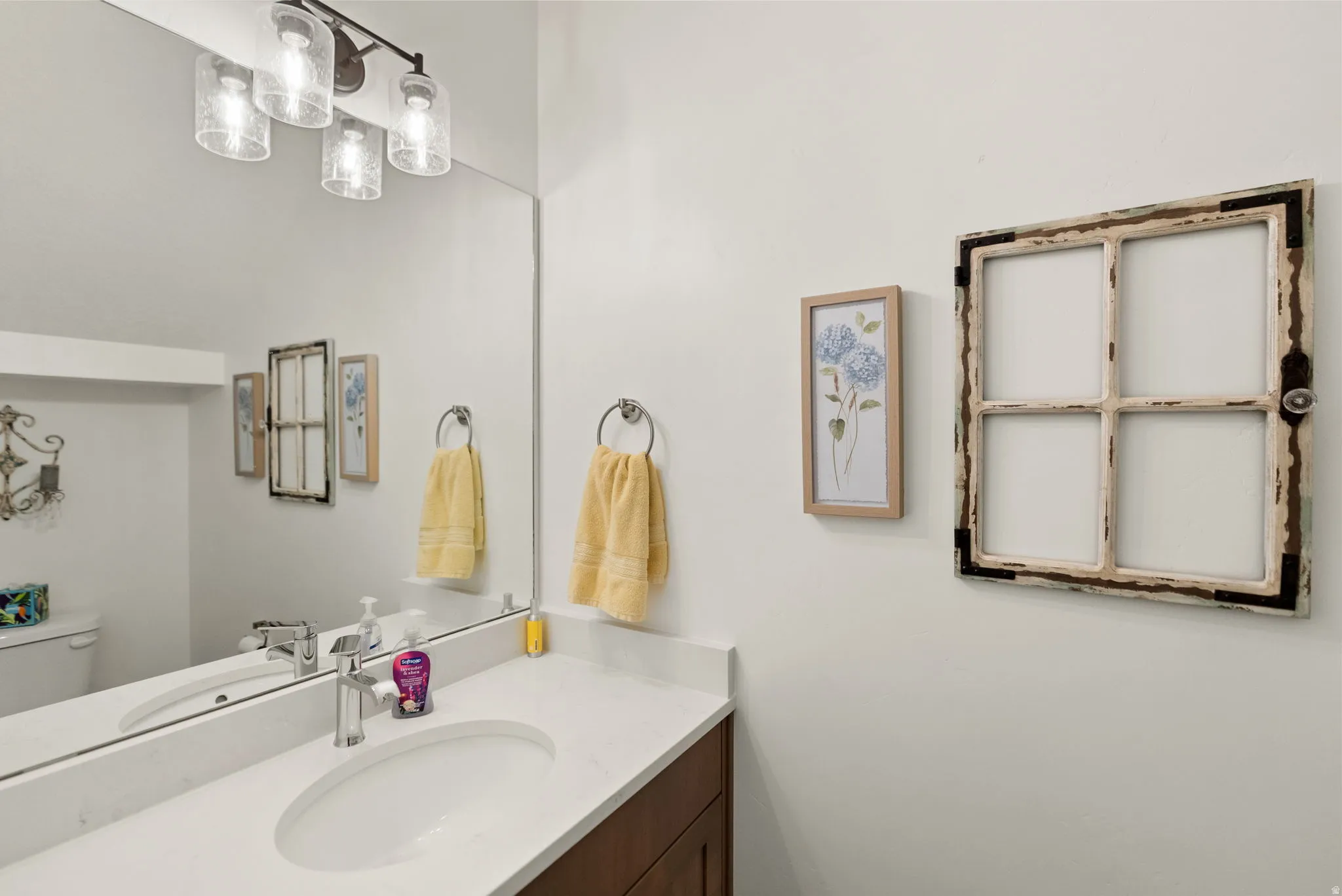 Half bath with vanity and toilet