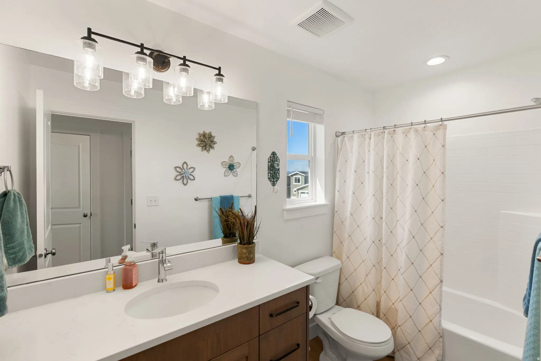 Full bathroom with vanity and shower / tub combo