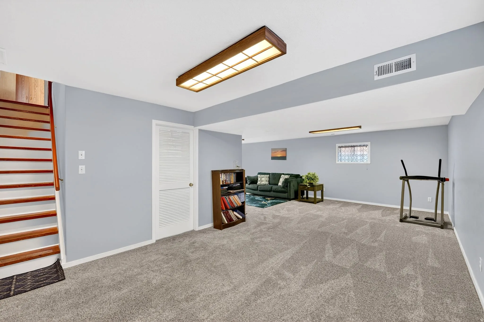 Sitting room with carpet and baseboards