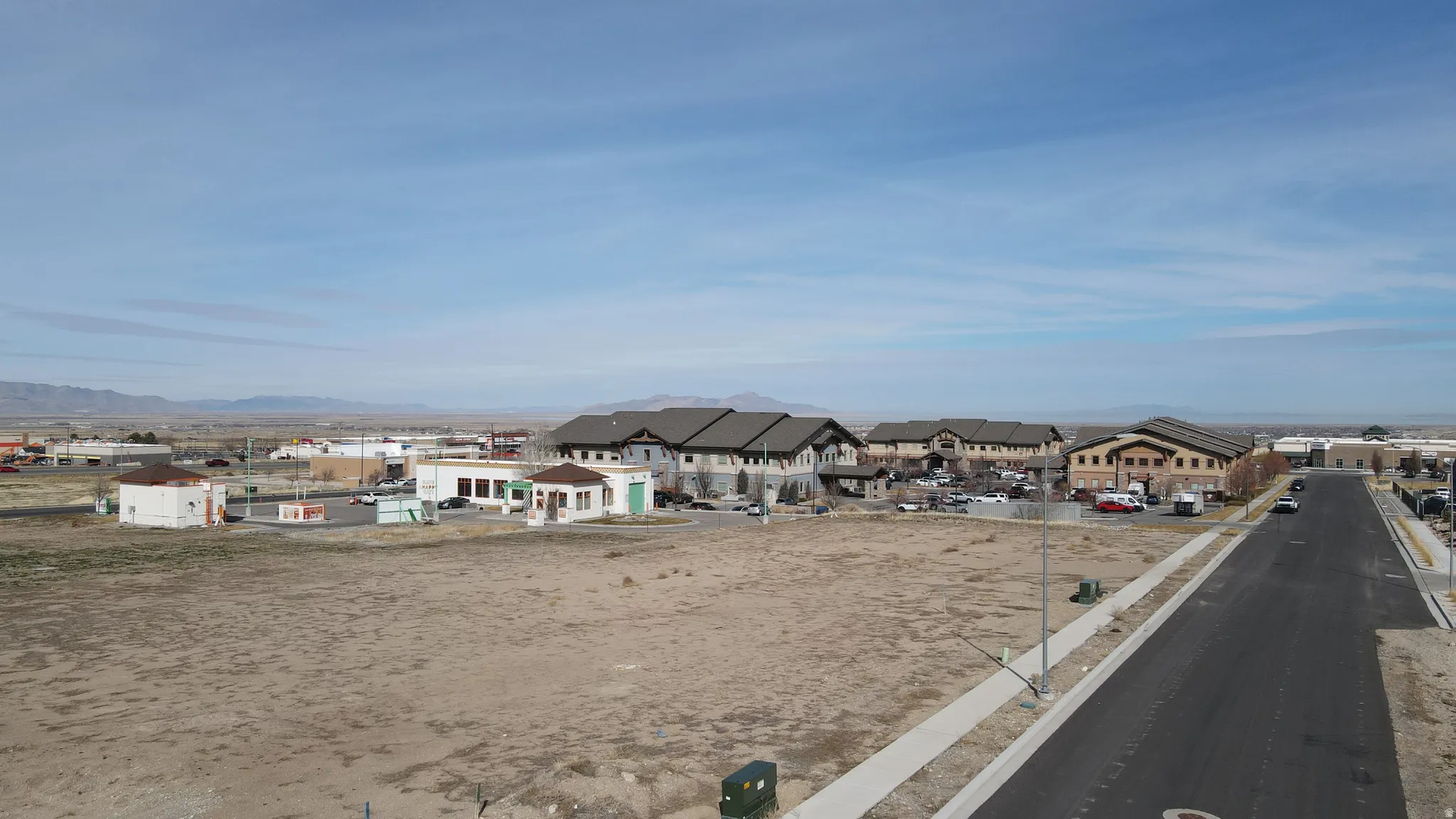 View of asphalt road featuring a residential view