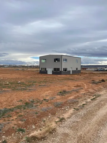 View of pole building featuring a rural view