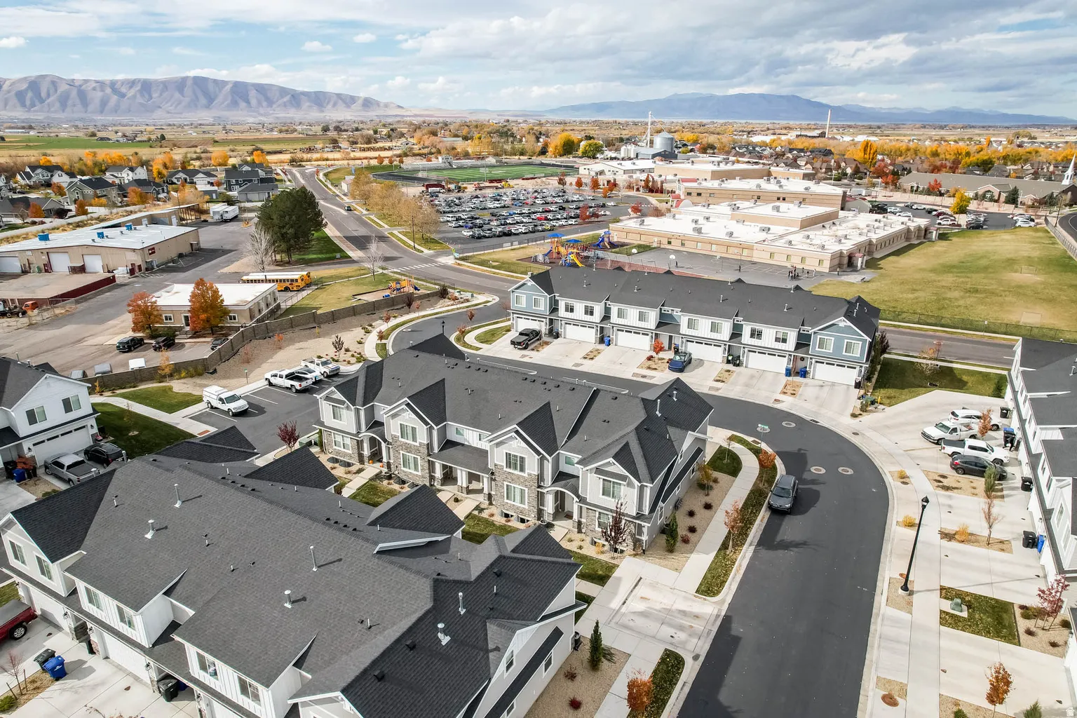 Aerial overview of property's location featuring a mountainous background