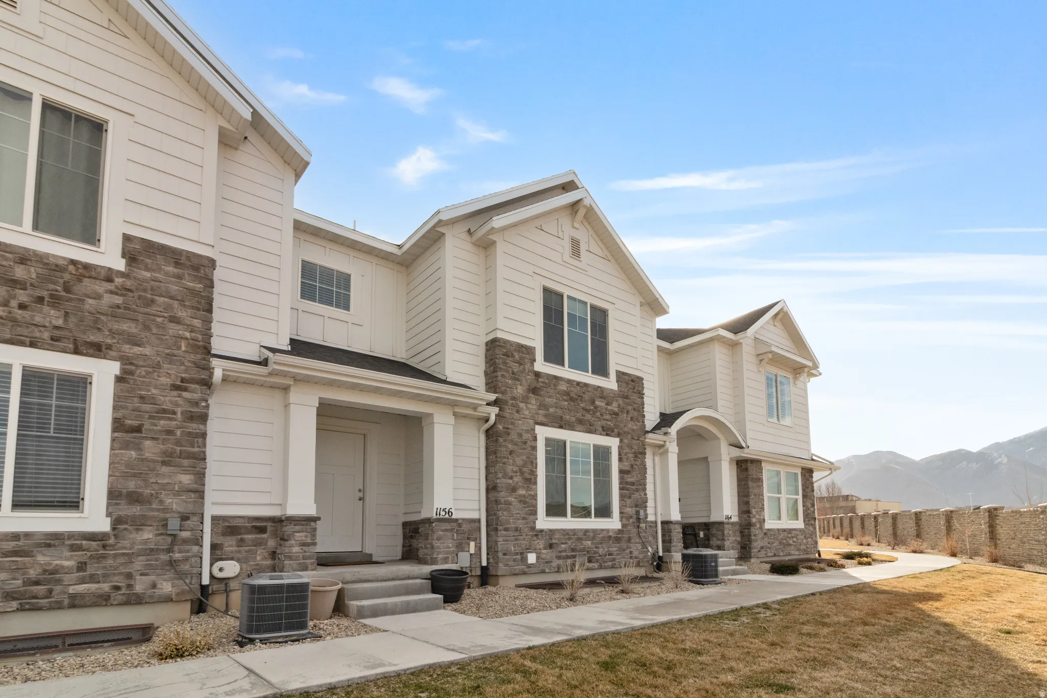 View of front facade featuring stone siding and a mountain view