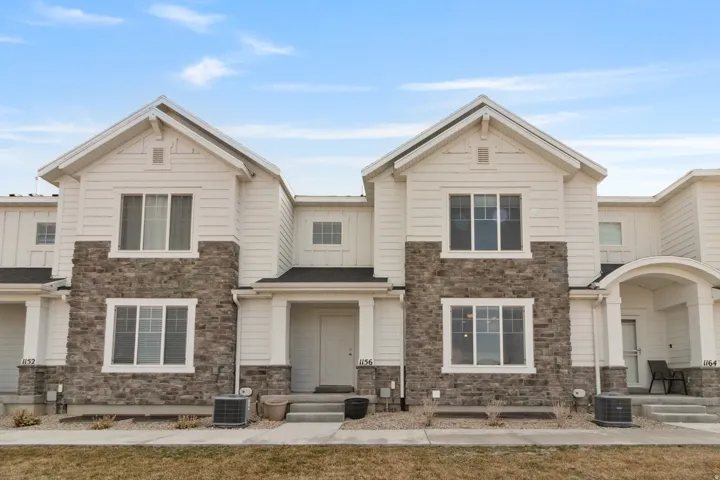 View of front facade with stone siding