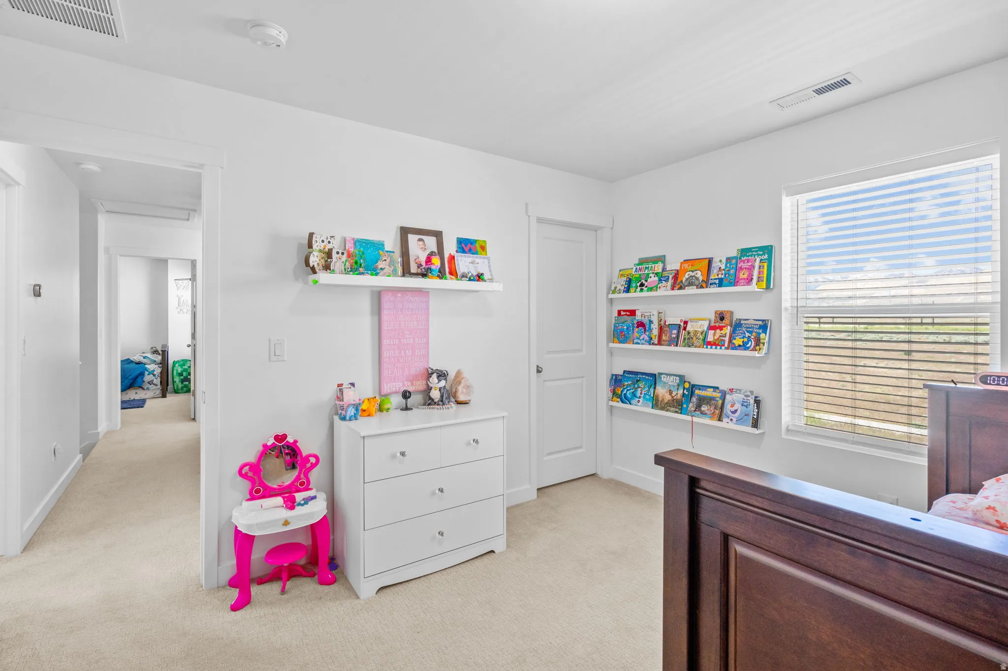 Bedroom with light carpet