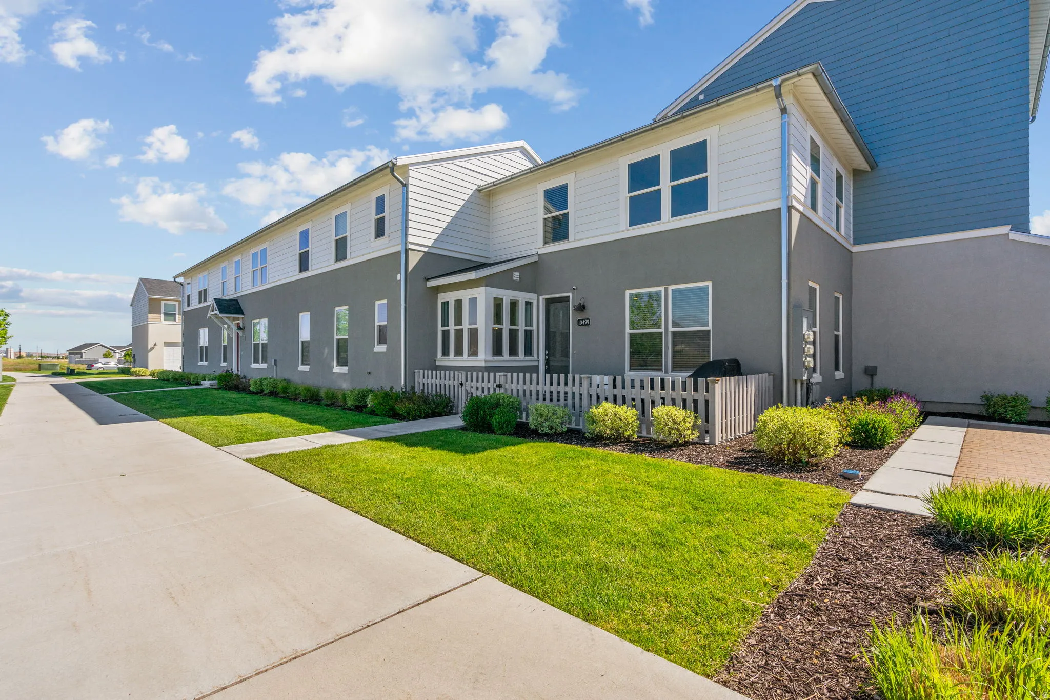 Rear view of house featuring stucco siding