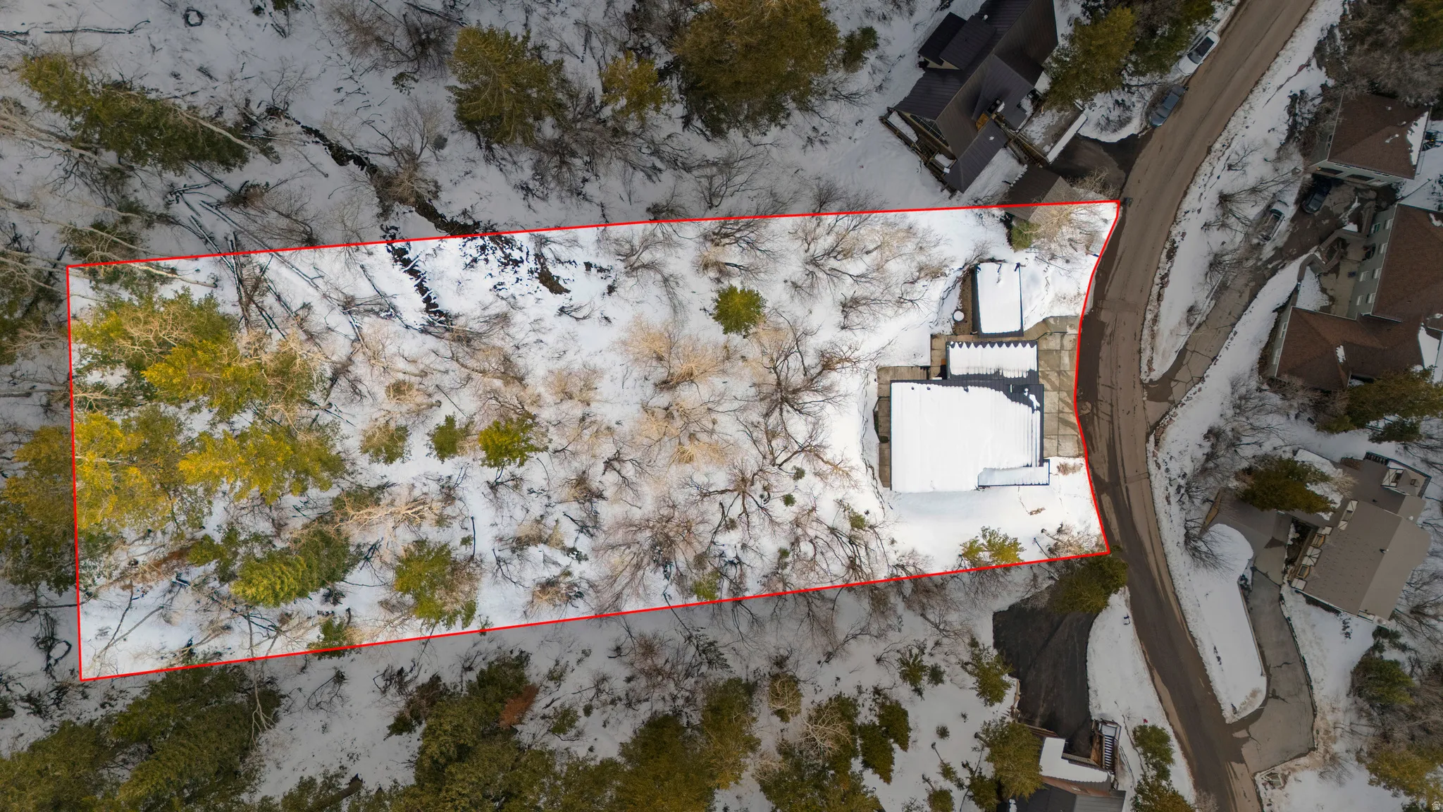 Aerial view with approximate property parcel outlined