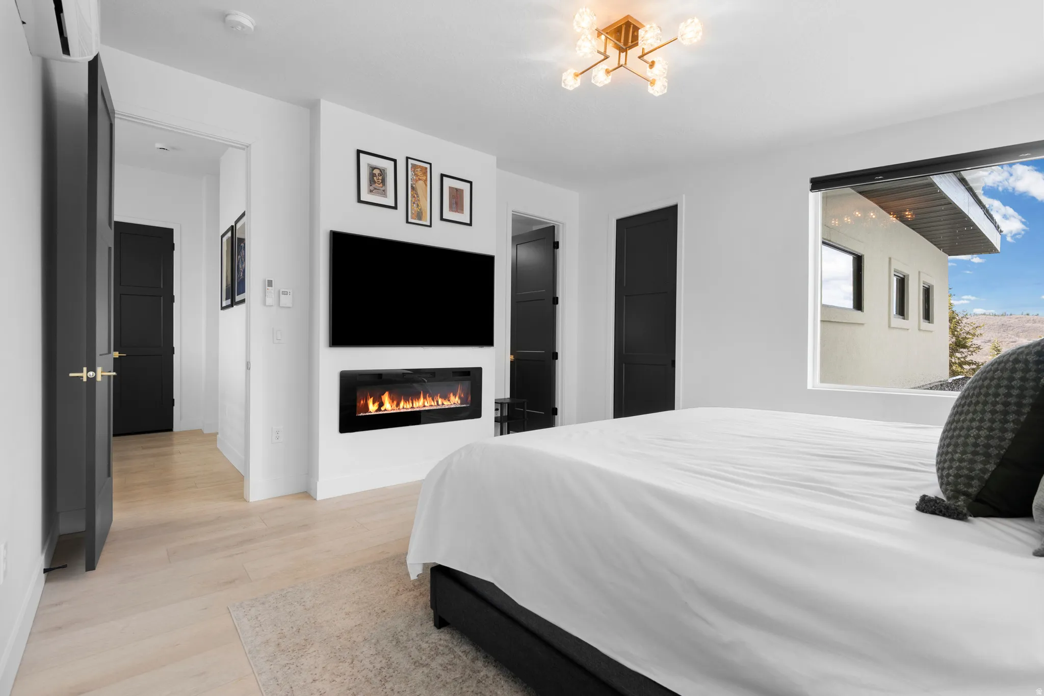 Primary Bedroom with Ensuite Bath, electric fireplace and two Walk-in Closets