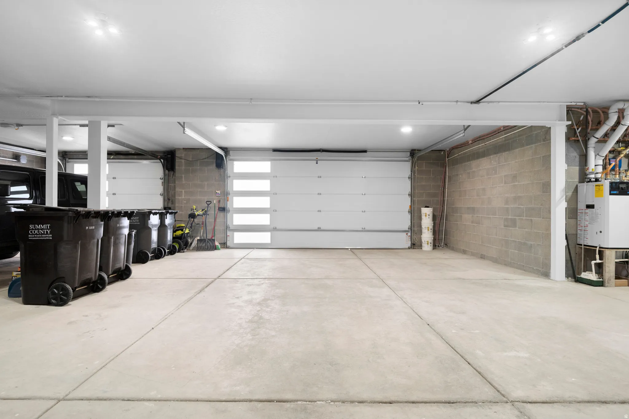 Oversized 3-car Heated Garage w/ Hose Bibs, and 240V charging capacity.