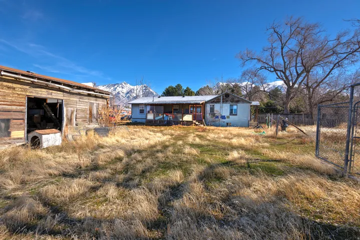 View of yard featuring a gate and a mountain view