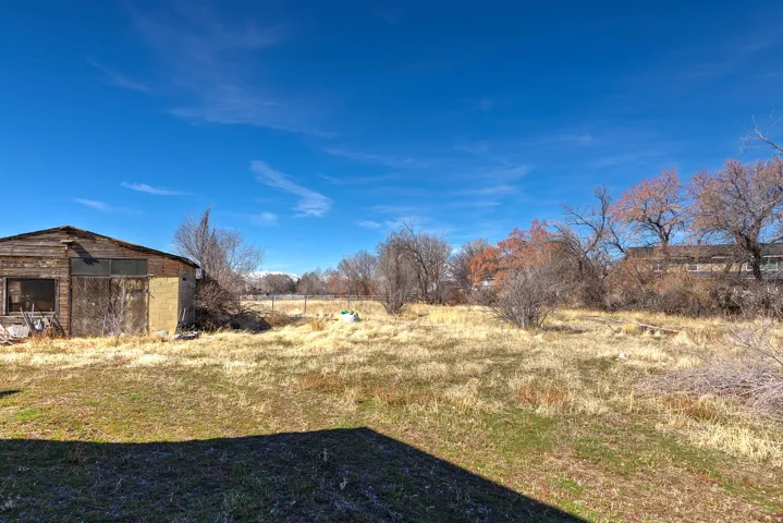View of yard featuring an outdoor structure and a view of countryside