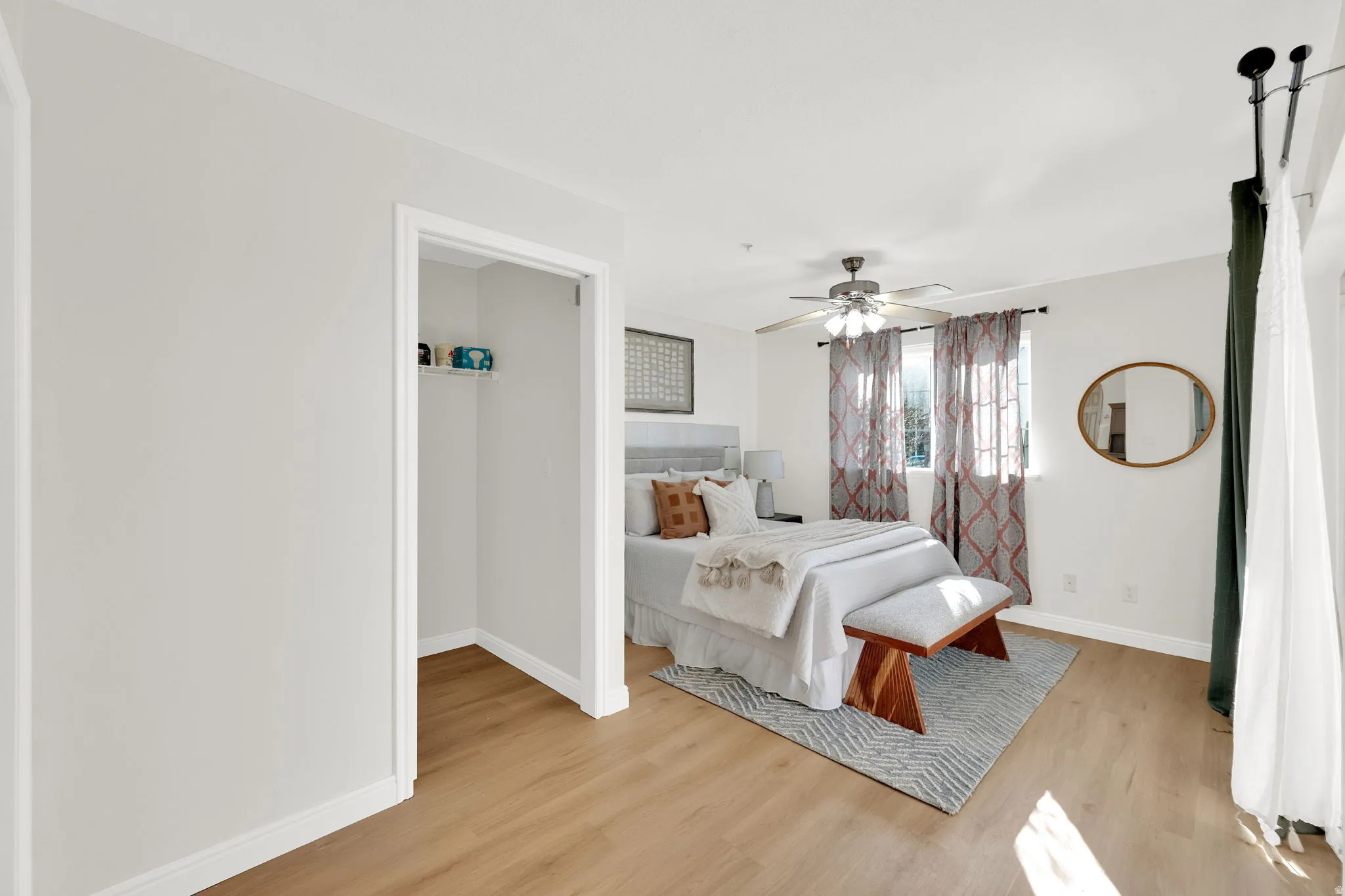 Bedroom featuring light wood finished floors and a ceiling fan