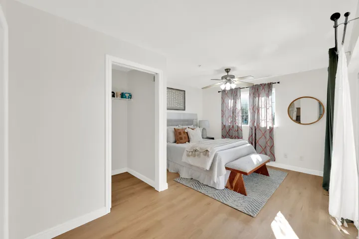 Bedroom featuring light wood finished floors and a ceiling fan
