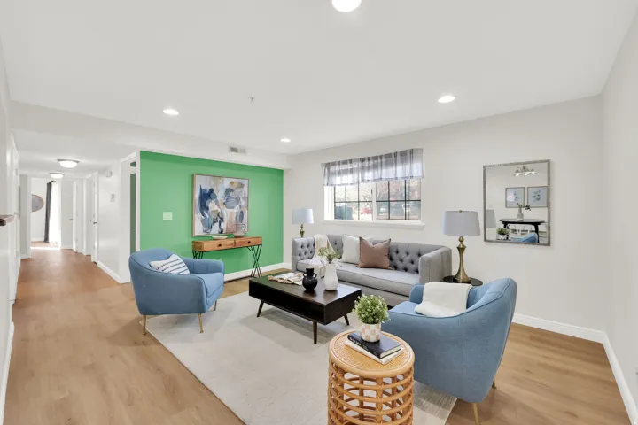 Living area featuring light wood-type flooring and recessed lighting
