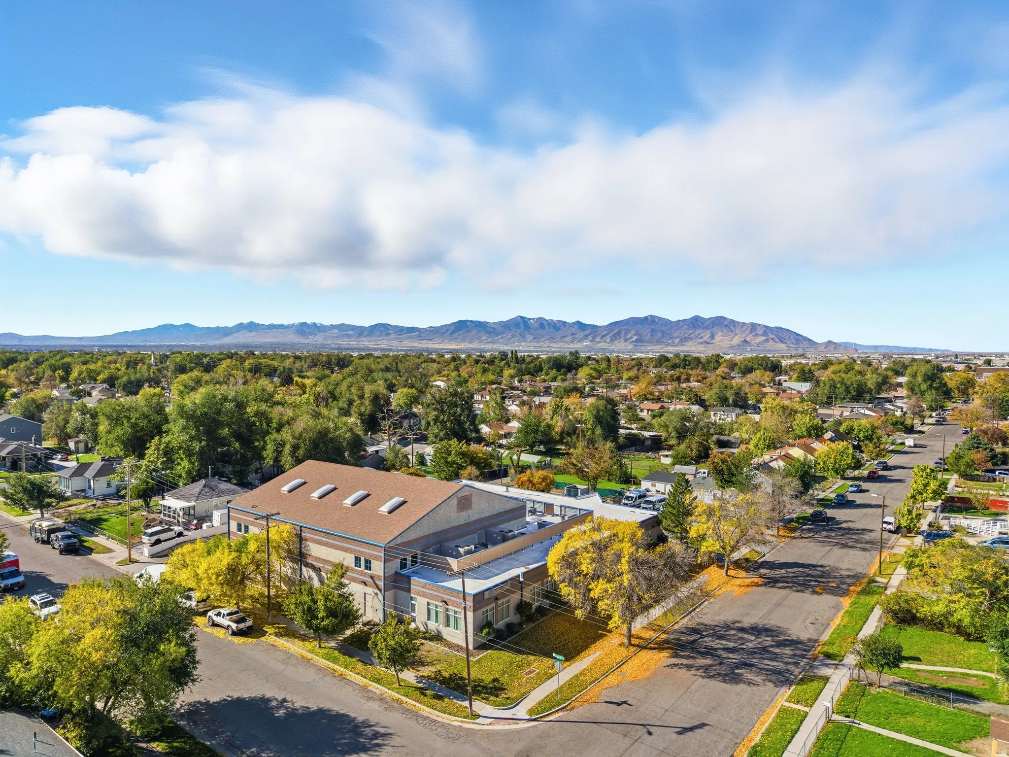 Aerial view of residential area featuring a mountainous background