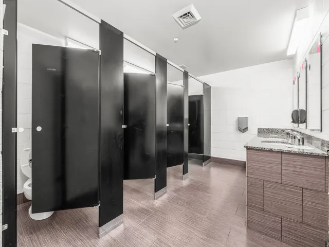 Bathroom featuring vanity and tile walls
