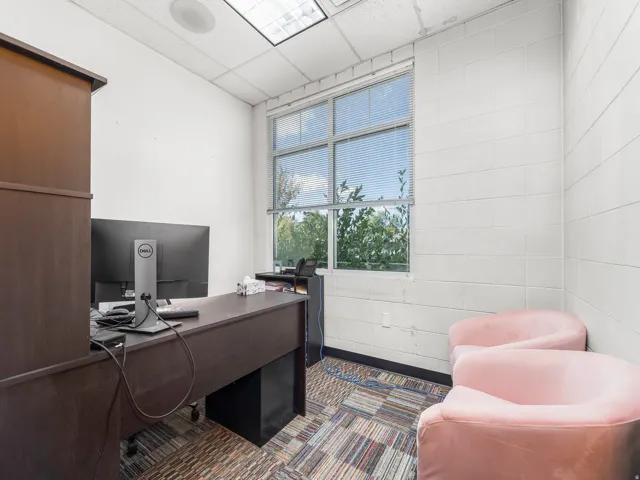 Office space with a paneled ceiling