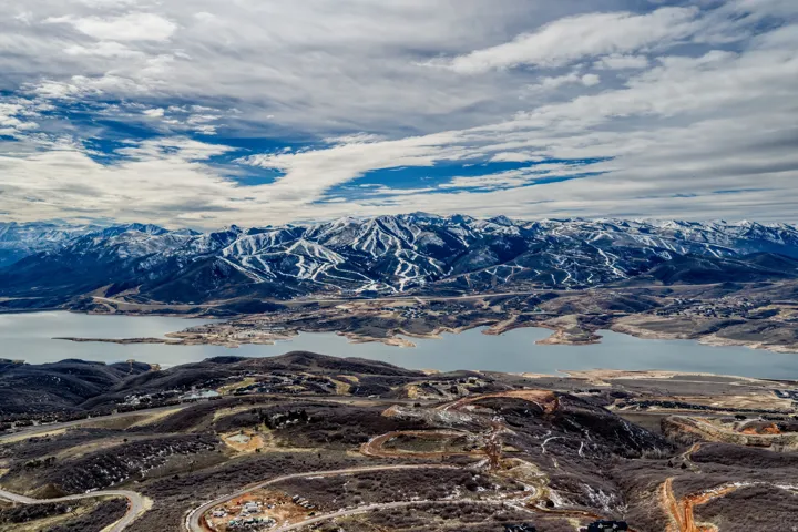 View of mountain backdrop featuring a large body of water