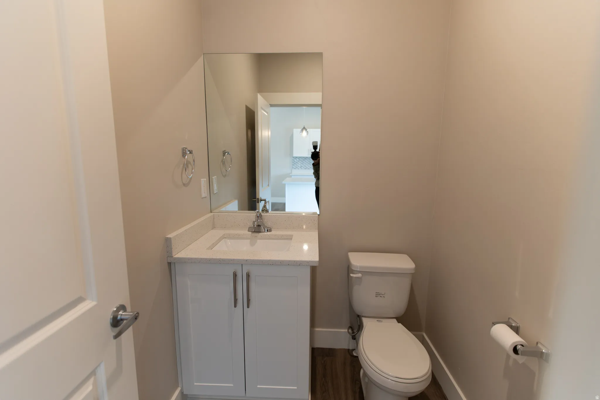 Bathroom featuring vanity and dark wood-style floors