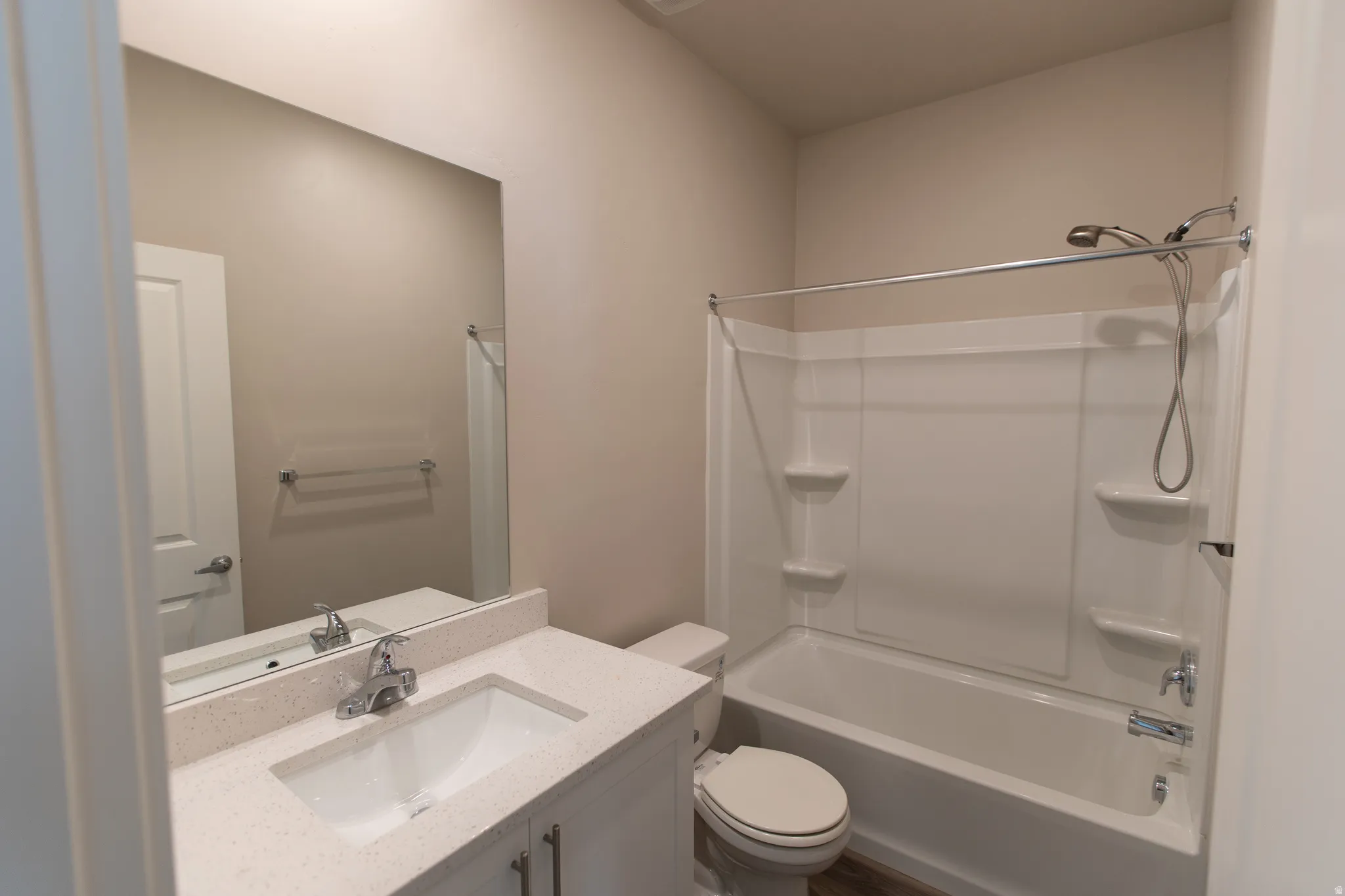 Full bath with vanity and bathtub / shower combination