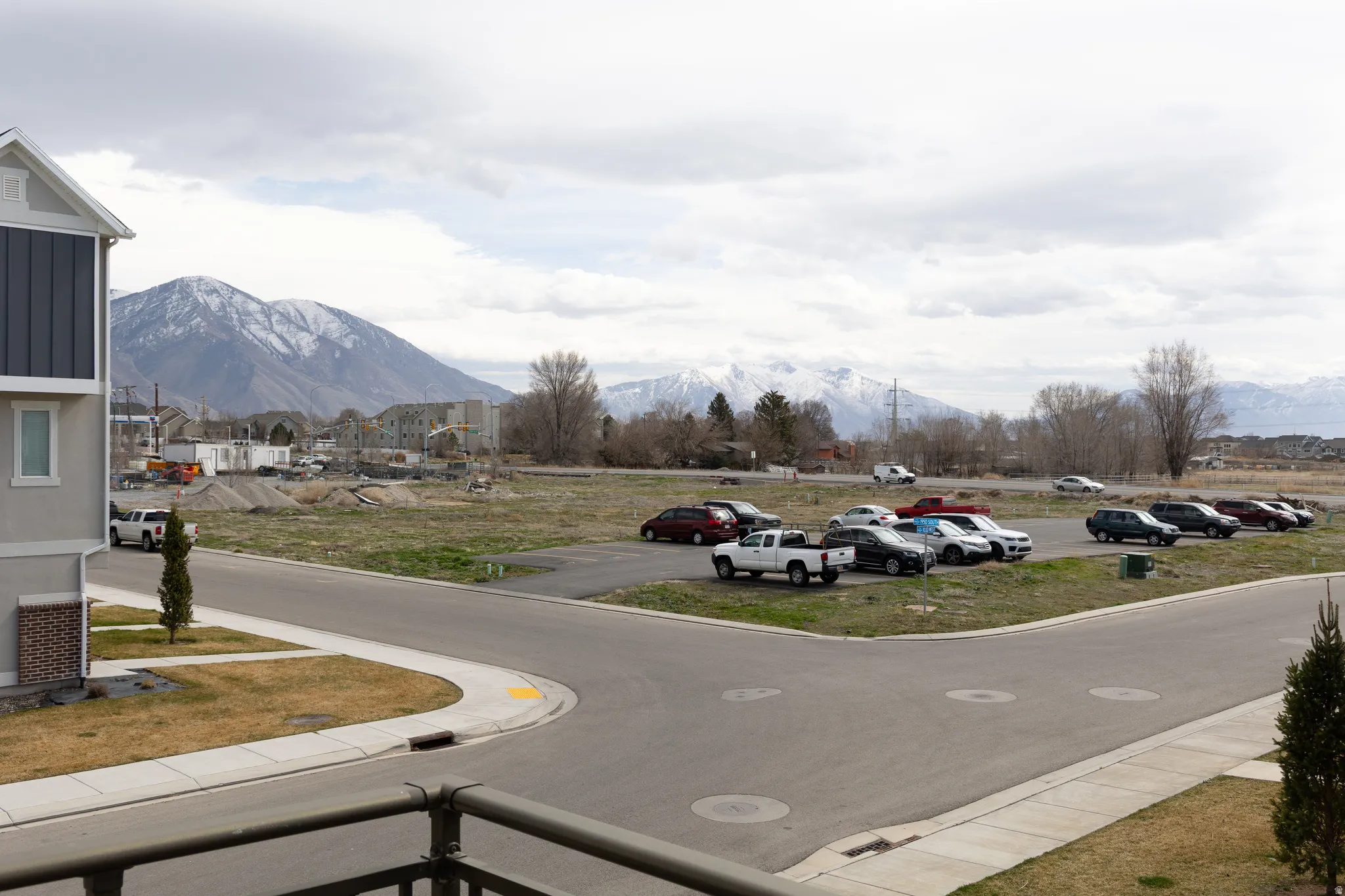 View of asphalt street featuring a mountain view