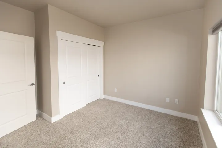 Neutral-toned carpeting throughout