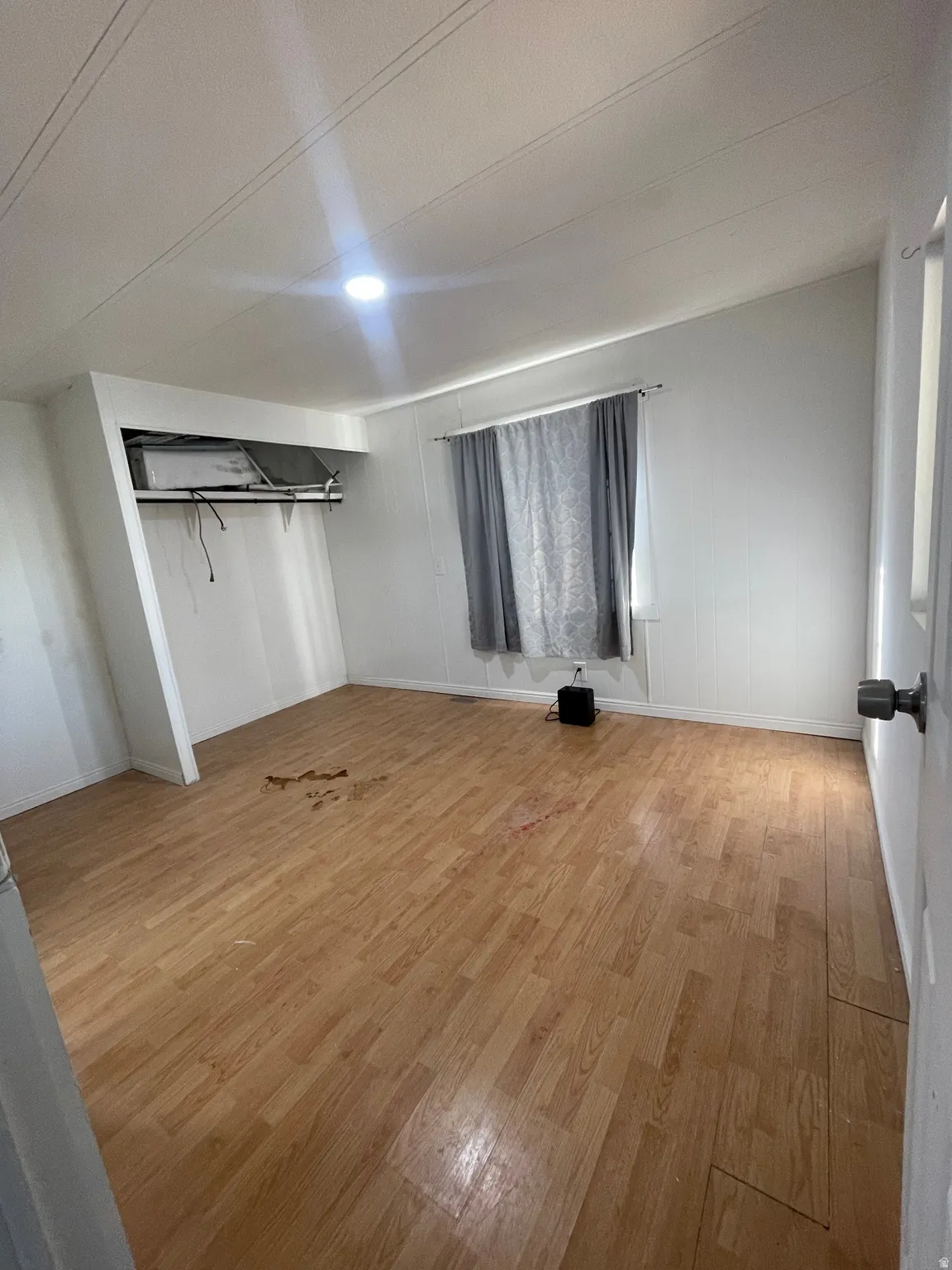 Unfurnished bedroom featuring light wood-style floors