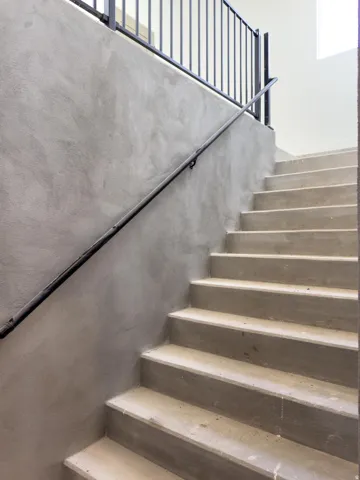 View of stairway going down to the basement entry
