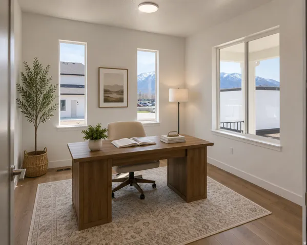 Virtually Staged...Spacious room with wood-finish flooring, white walls, and multiple windows